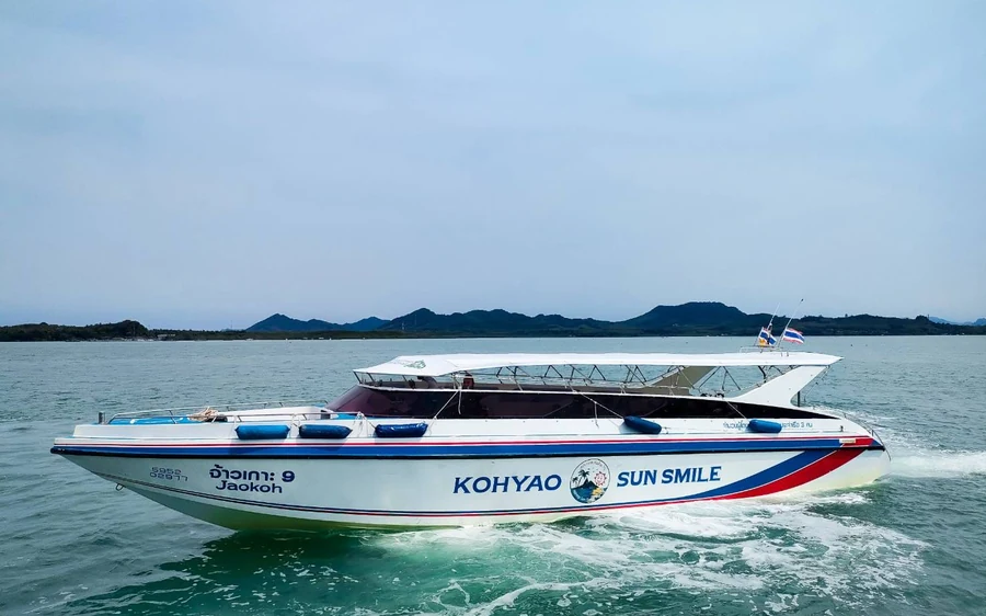 A speedboat passing the Koh Yao islands in the middle of the bay